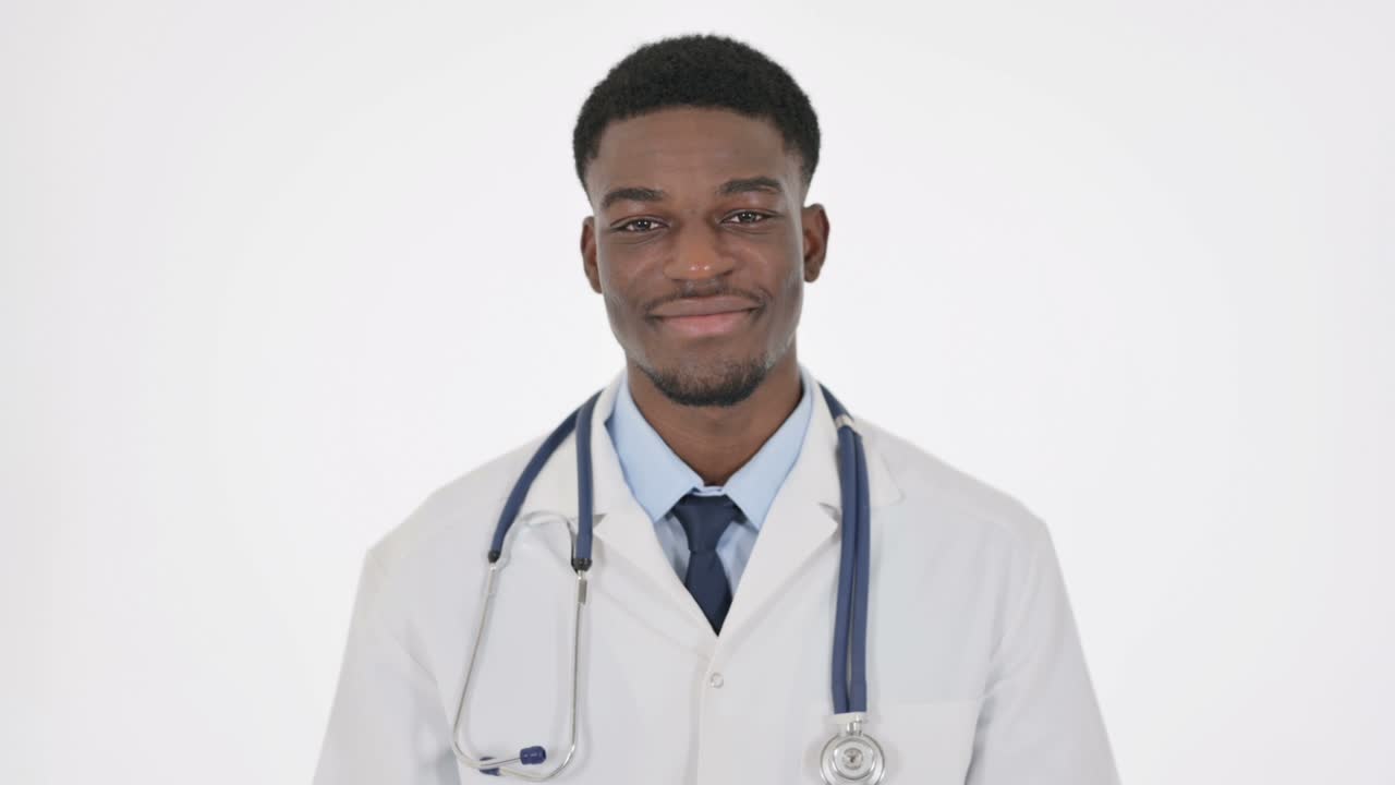 African Doctor Shaking Head as Yes Sign on White Background