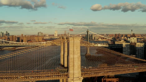 Busy-road-leading-on-bridge-over-river.-Bridges-between-Brooklyn-and-Manhattan-in-setting-sun.-New-York-City,-USA