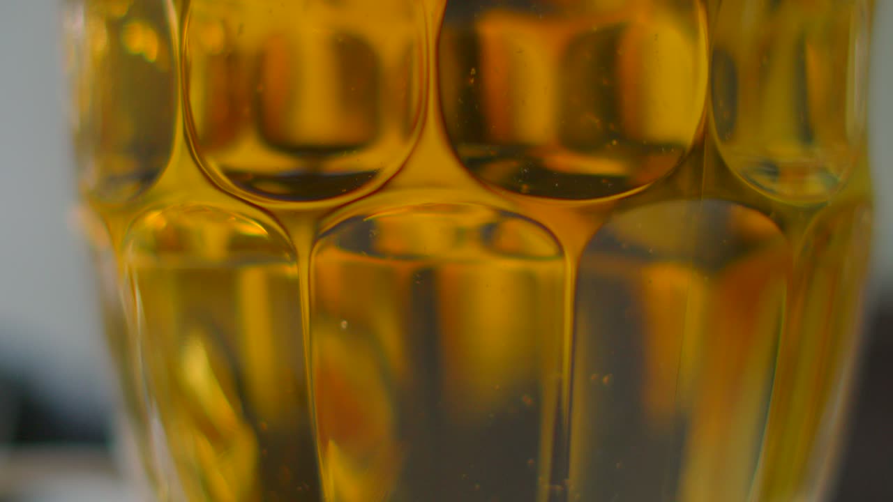 Static Shot of Beer with Bubbles Gently Rising in Traditional Lager Glass. Freshly Chilled Alcoholic Beverage