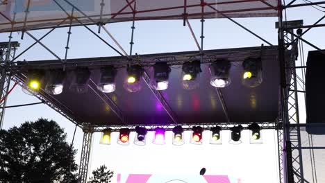 vibrant stage lights illuminating a performance area with various colors