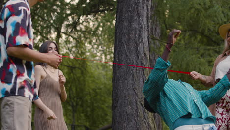 friends playing limbo outdoors