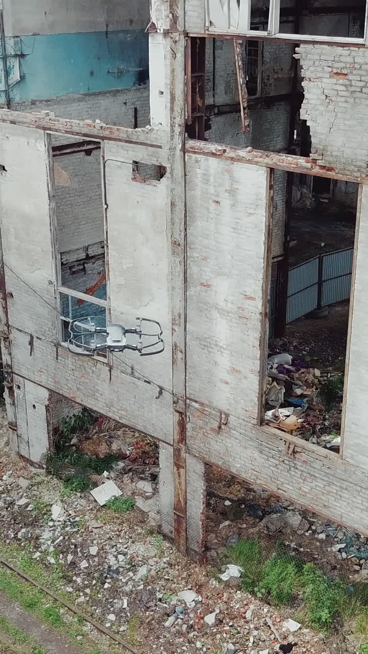 Drone view of an abandoned industrial sites. Factory ruins.. Vertical video