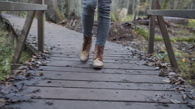 Woman walks slowly on a bridge