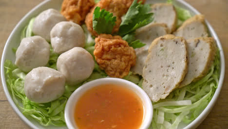 boiled fish balls, shrimp balls and chinese fish sausage with spicy dipping sauce