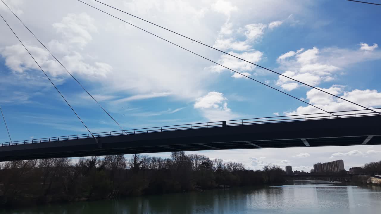 Drone flying over Garonne river and bridge in Toulouse France