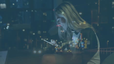 woman using smartphone and cityscape
