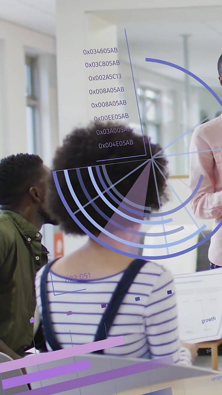 Vertical video: Presenter gesturing and showing rising biz charts over laptop team reviewing data