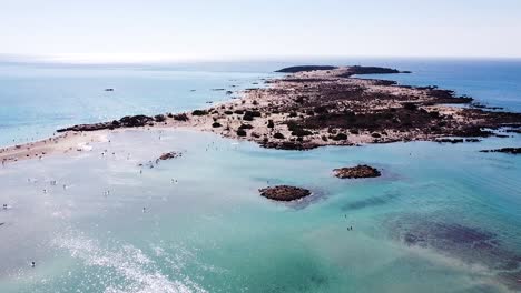 tropical elafonissi beach and blue sea water in crete, aerial view