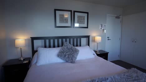 slowmo - luxury modern boutiqe hotel room double queensize bed with lamps, ocean sea view