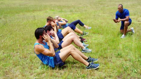 fit people performing crunches exercise 4k