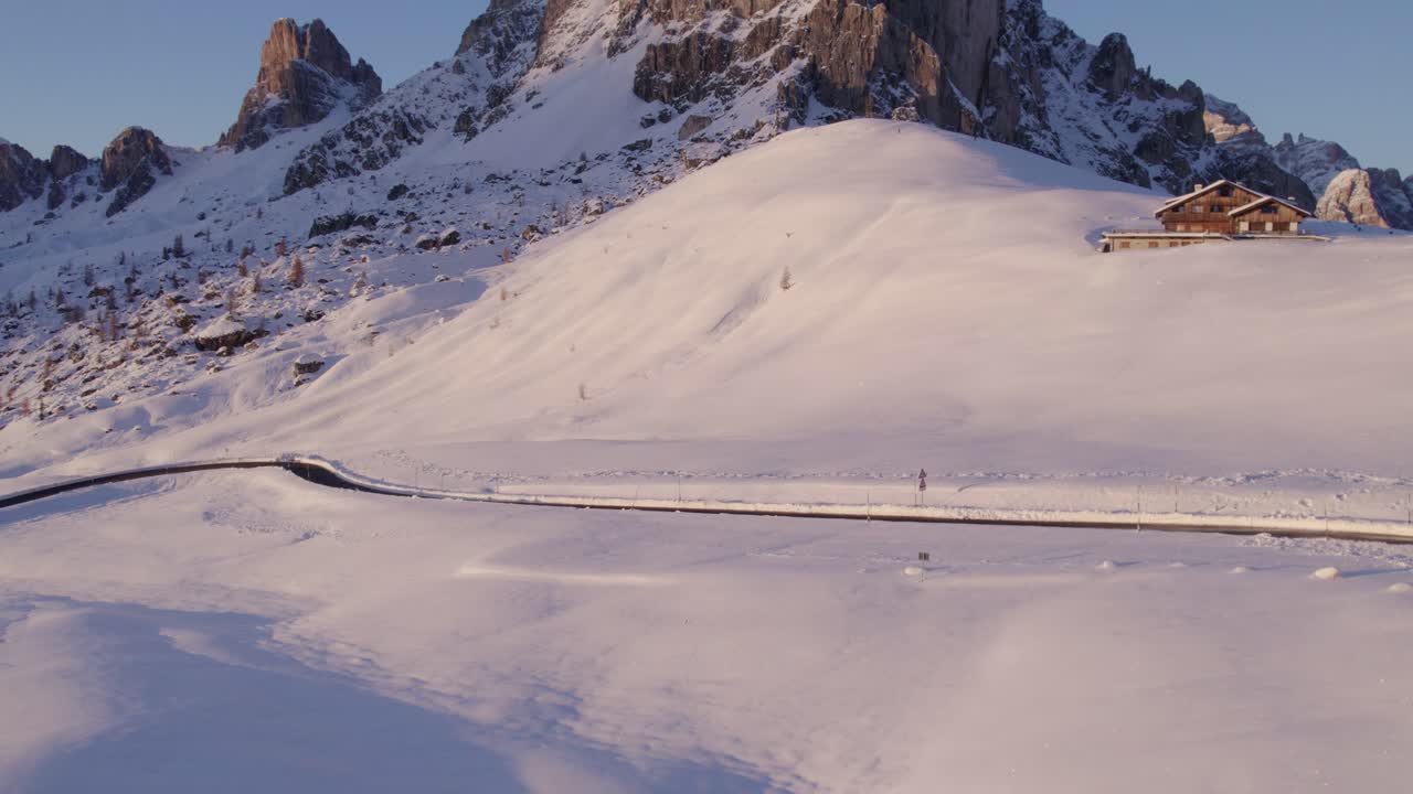 Sunset over snow-covered Dolomite peaks, Passo di Giau, Italy