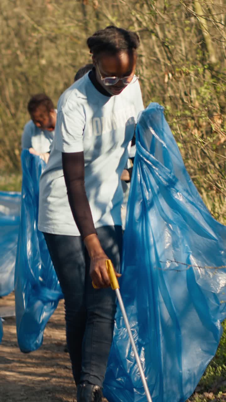 Diverse Group of Volunteers Cleaning Up Trash in a Park