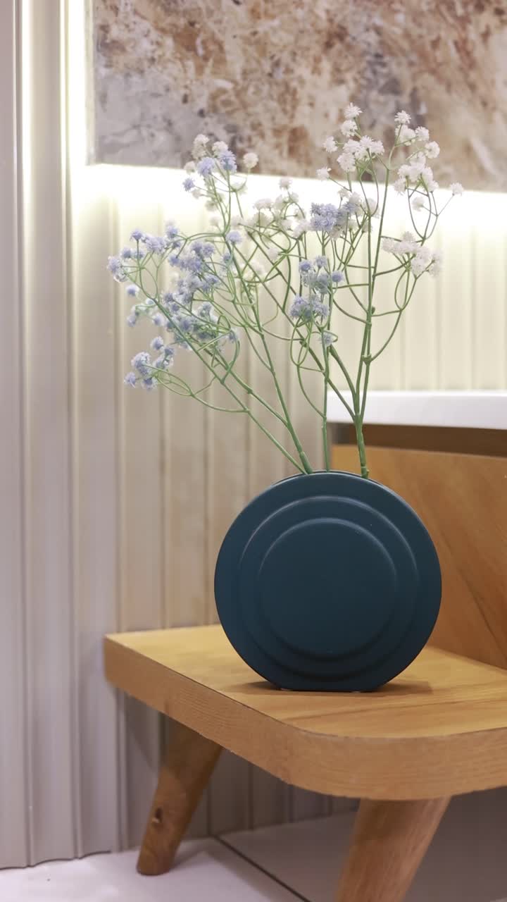 cinematic shot of flowerpot in the bed room