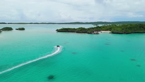 tender boat going towards small fijian island