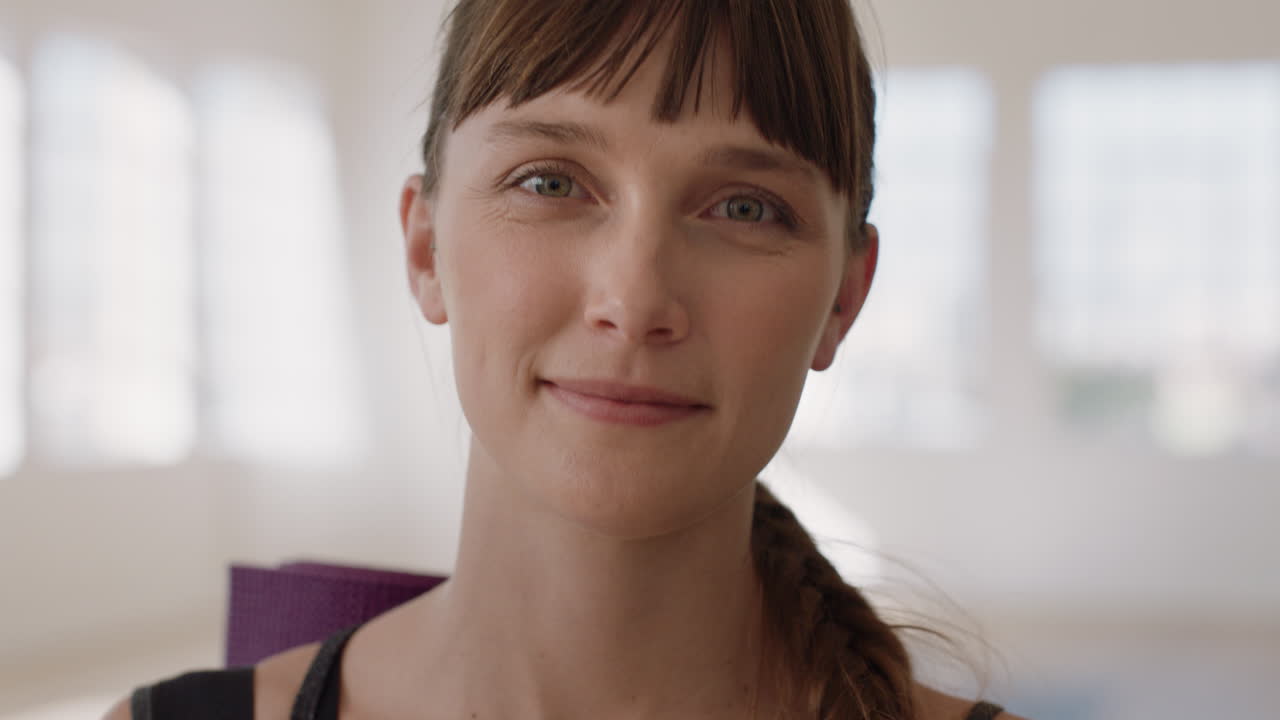 portrait beautiful caucasian woman smiling enjoying yoga class practicing healthy lifestyle in fitness studio