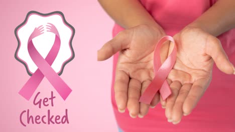 Animation-of-pink-ribbon-logo-with-breast-cancer-text-over-women-hands