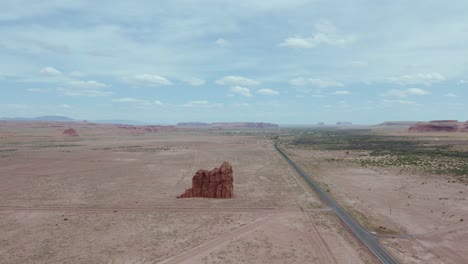 rock formation standing alone in arid, southwest desert of arizona - aerial