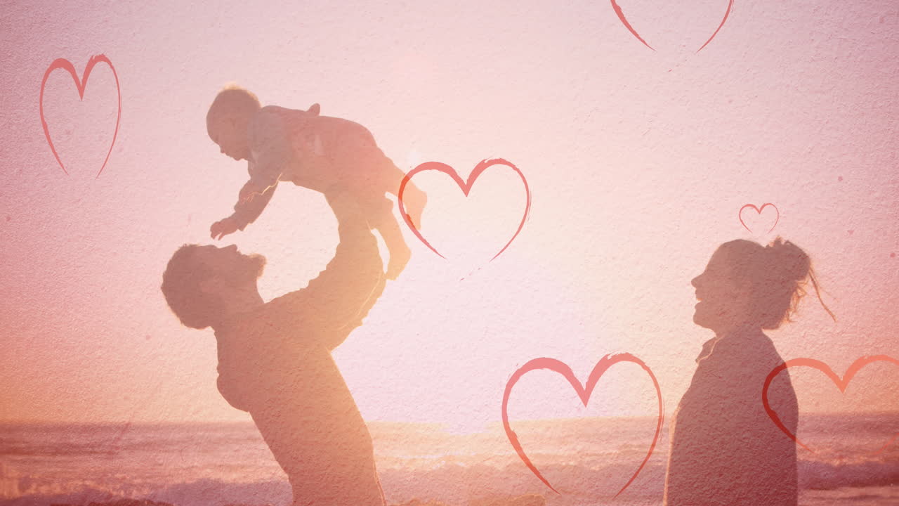 해변에서 백인 가족을 향해 떨어지는 마음의 애니메이션