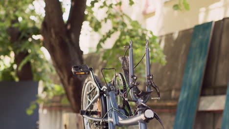 energetic woman grabbing bicycle wheel