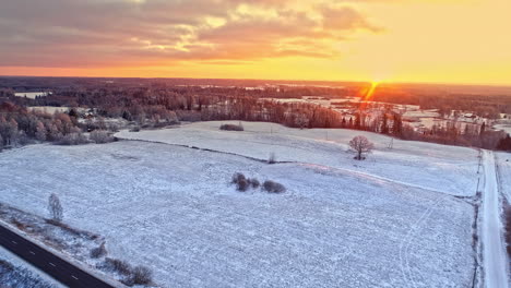 Aerial-drone-cinematic-view-of-the-frozen-mountain-landscape-on-a-sunny-day-at-forest-background