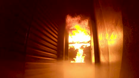 slow motion, pov, of flashover during firefighter training inside a burning simulator