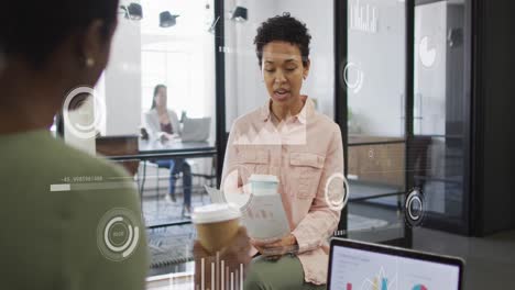 animation of data processing over diverse business people talking in office