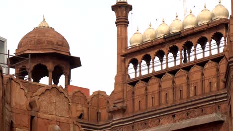 telephoto india national flag waving in wind on top of red fort