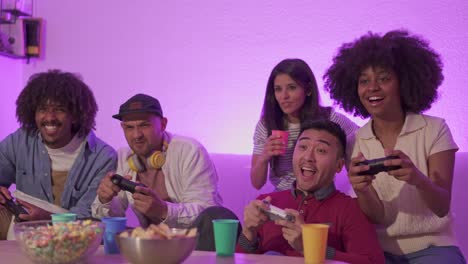 diverse group of friends playing video games at home