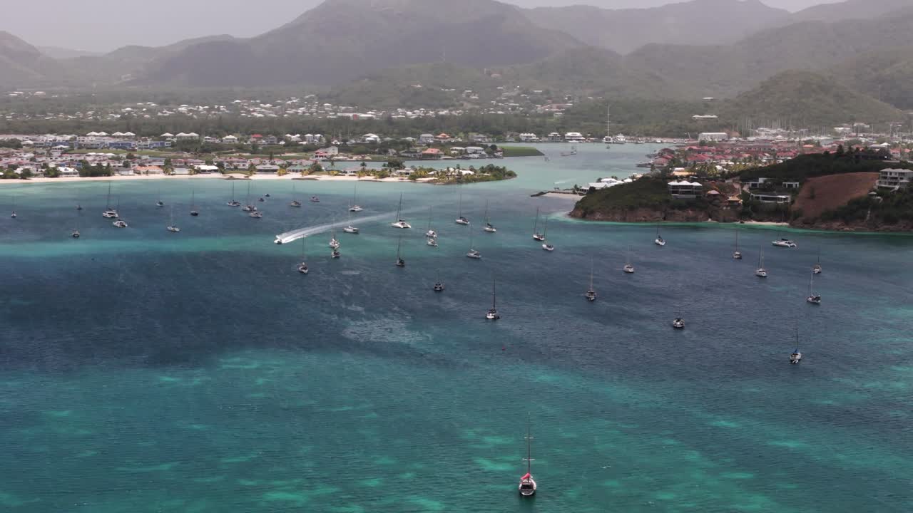 Aerial View of a Tropical Harbor with Many Sailboats