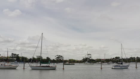 Slide-overflight-of-yachts,-boats-in-Auckland-harbour,-aerial-shot