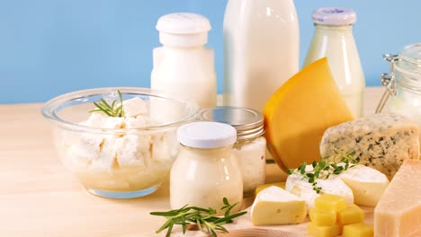 assorted dairy items arranged on a wooden table