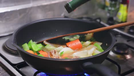 adding wine to a sauce pan