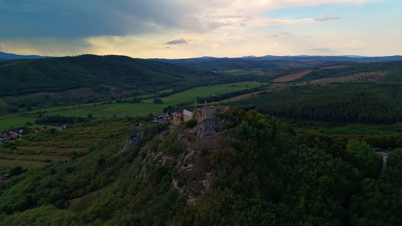 Orbital drone hyperlapse around the Castle of Sirok with the beautiful Mátra Mountains around in Hungary