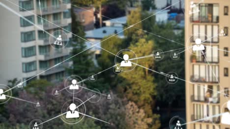 animation of network of connections with people icons over cityscape