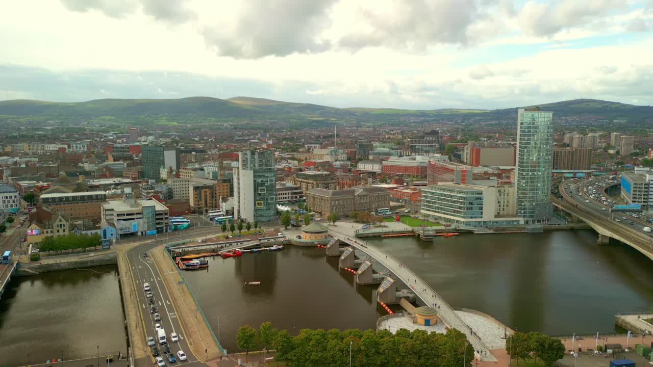 Slow forward travelling 4K aerial video of Belfast City centre on a bright and sunny afternoon. Produced in 4K, 60FPS and with Rec709 color