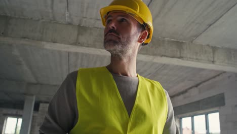 close up low angle footage of caucasian engineer browsing a digital tablet on construction site.