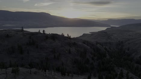 cliffside canvas: drone views of kamloops lake and lush grassland