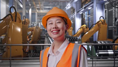 factory worker observing robotic equipment