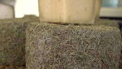 cheese with rosemary selling on the market