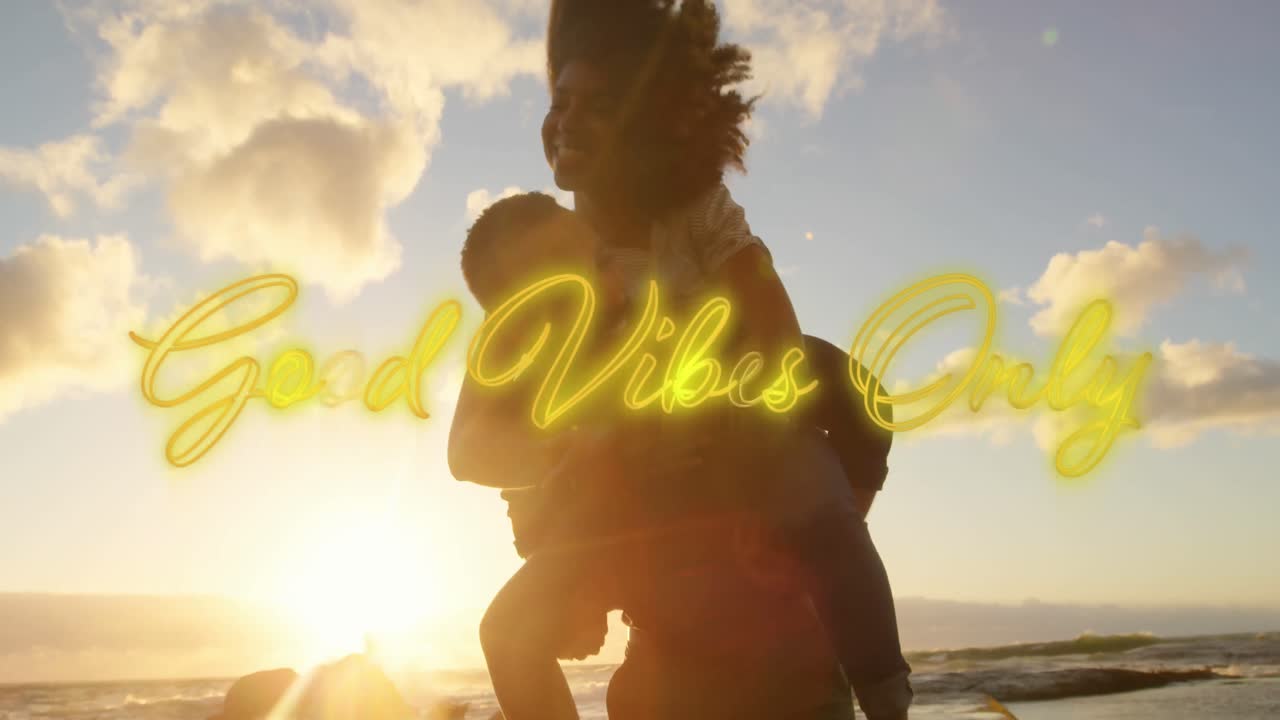 Animation of text vibes over people by seaside