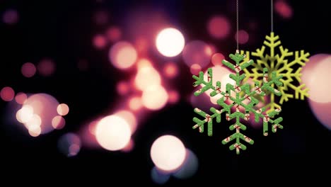 los adornos de copos de nieve de navidad se balancean en el fondo de bokeh archivo de bucle