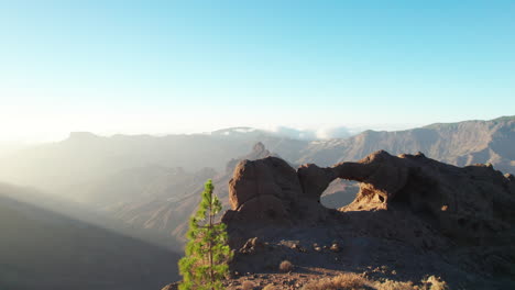 ventana del bentayga (bentayga's window): where the rock kisses the sky and frames the roque bentayga in gran canaria, canary islands.