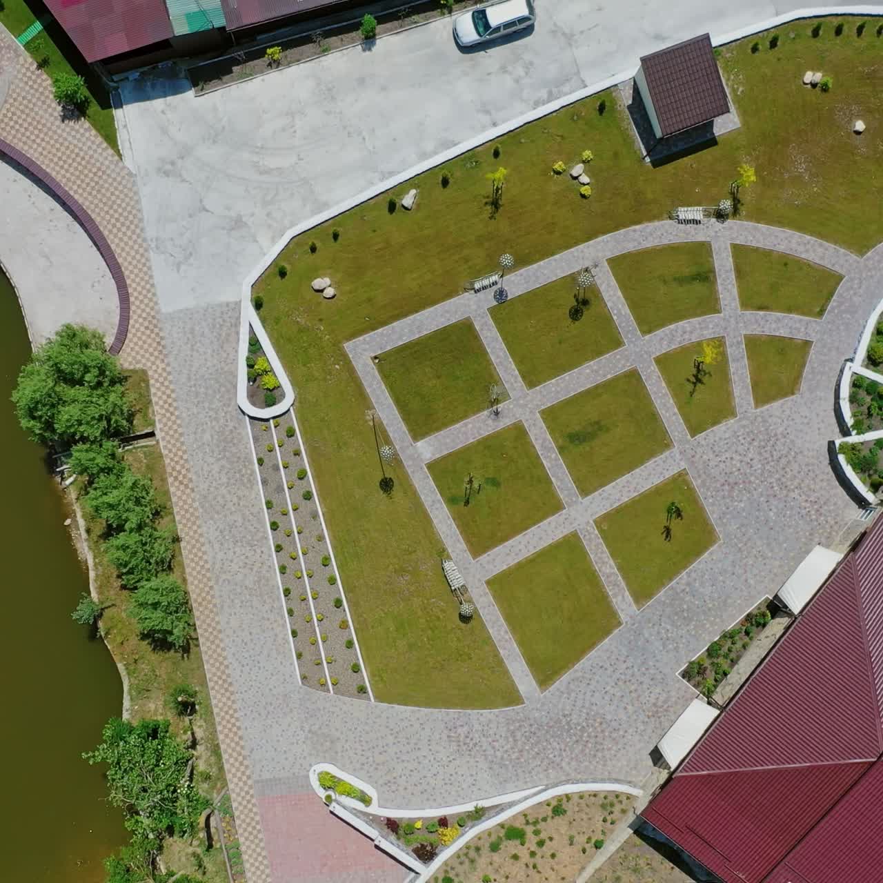 Modern recreation complex in summer. New buildings near the river of a relaxing center. Motion camera around. Aerial view.