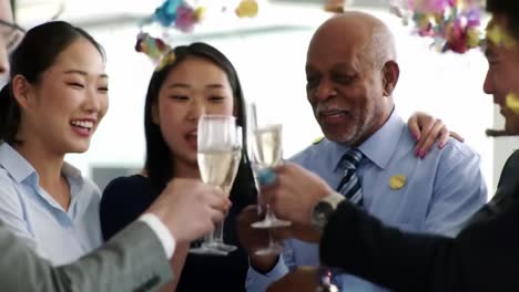 celebratory moments: a diverse group toasts together with sparkling drinks, sharing joyful laughter and cherished connections in an elegant setting