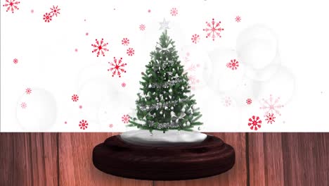 Animation-of-snow-falling-and-glowing-spots-over-snow-globe-with-tree-on-white-background