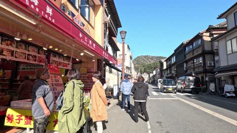 people walking, shopping in a traditional market.