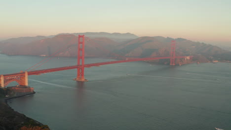 aerial slider shot of the golden gate bridge at sunrise