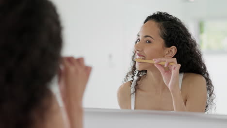 Woman,-toothbrush-and-brushing-teeth-in-mirror