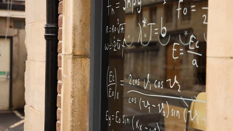 complex equations written on a blackboard