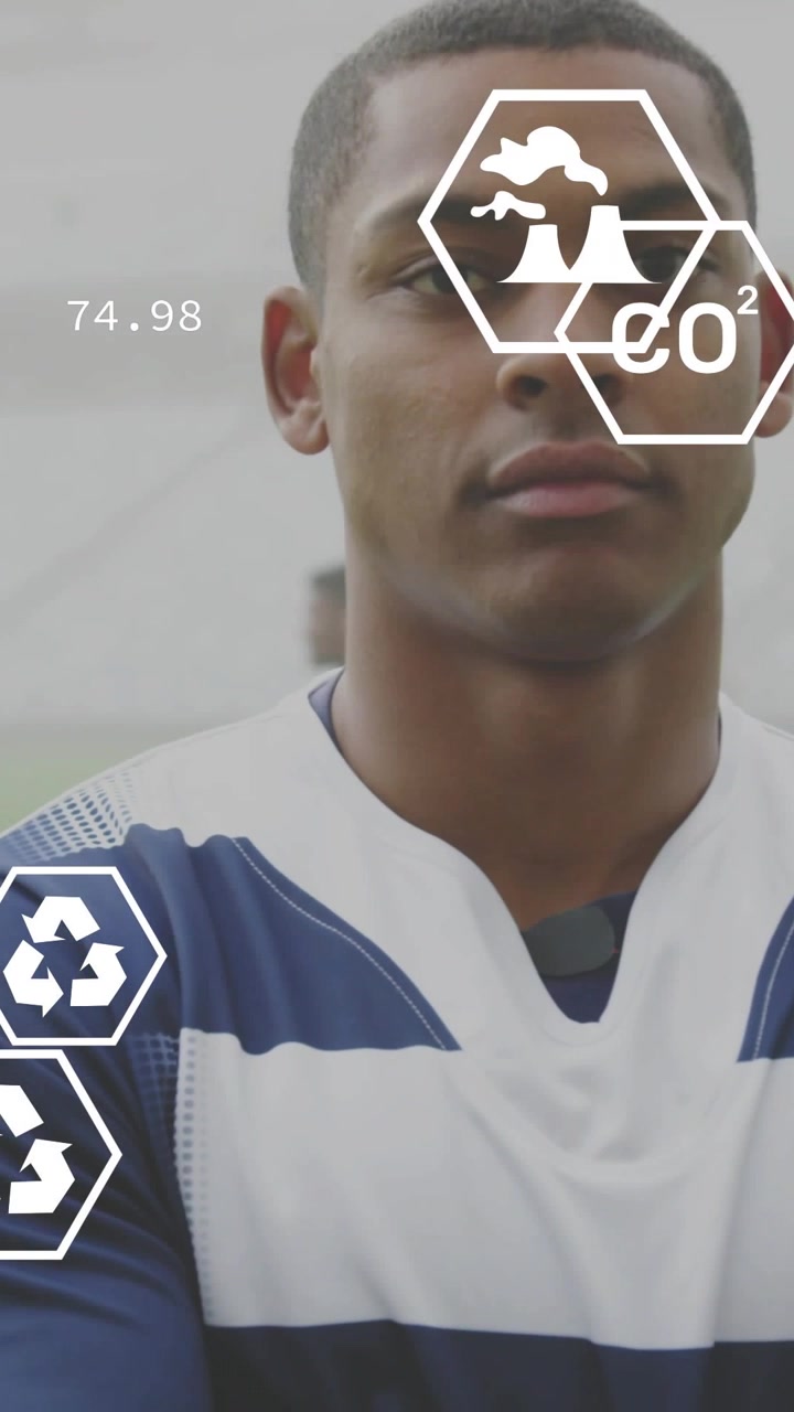 Vertical video: Male athlete posing on sports turf, hex HUD fading in and covering face showing CO2